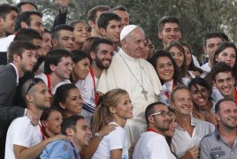 Pope Francis poses with young people during an encounter with youth in Cagliari