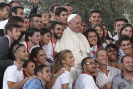Pope Francis poses with young people during an encounter with youth in Cagliari