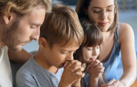 web3-family-pray-together-home-father-mother-child-shutterstock_1310080675-1200x762_c