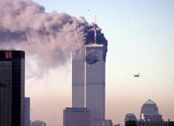 A hijacked commercial plane approaches the World Trade Center shortly before crashing into the landmark skyscraper 11 September 2001 in New York.   AFP PHOTO/Seth McCallister